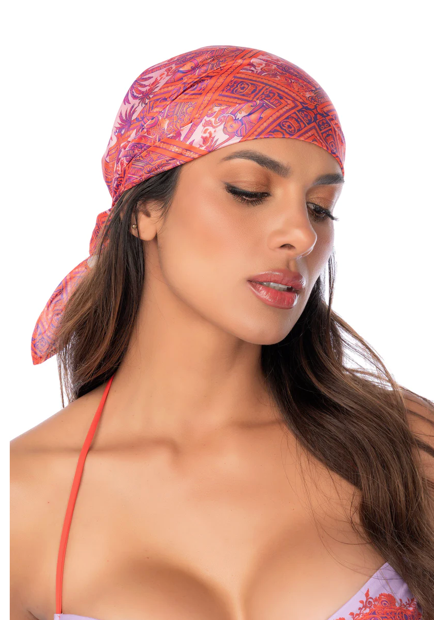 Woman wearing a colorful headscarf on a white background