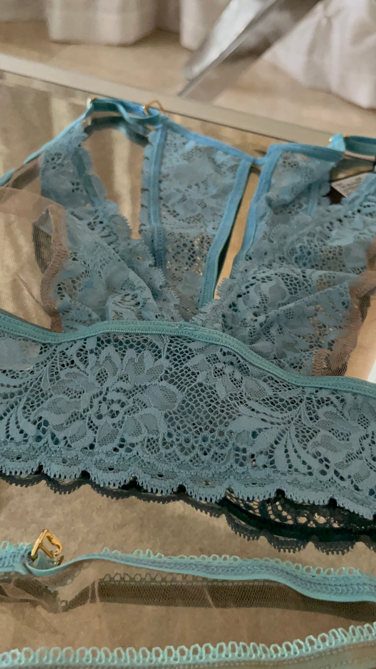 Close-up of nude lace and sheer tulle halter babydoll detail