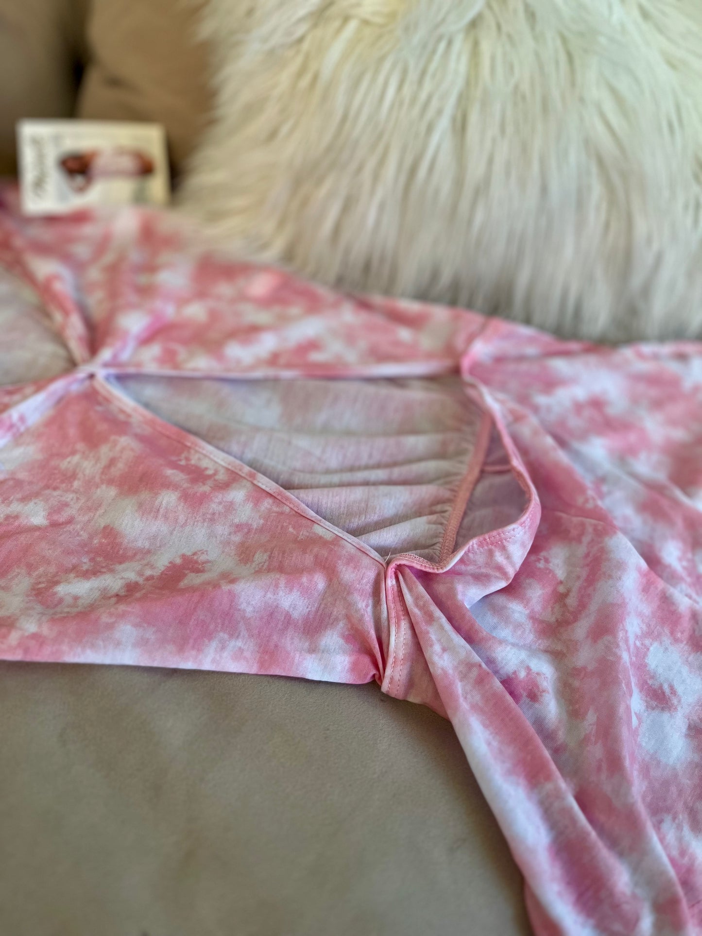 Close up of off shoulder neckline on pink tie dye sleeper