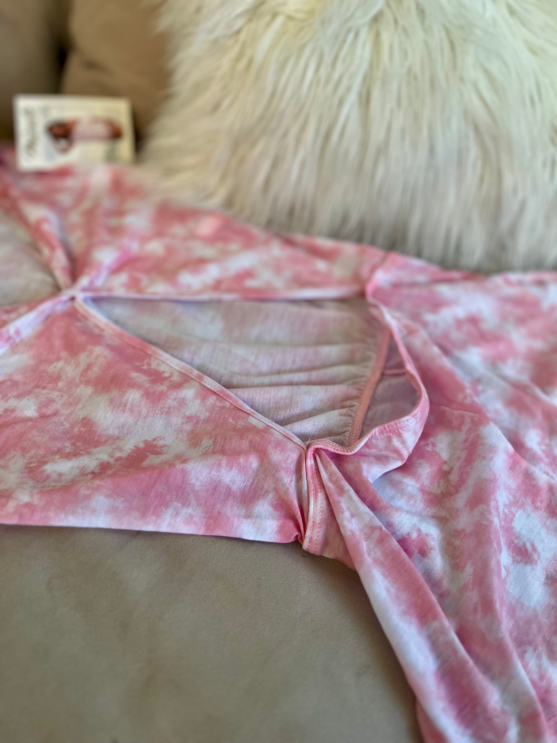 Close up of off shoulder neckline on pink tie dye sleeper