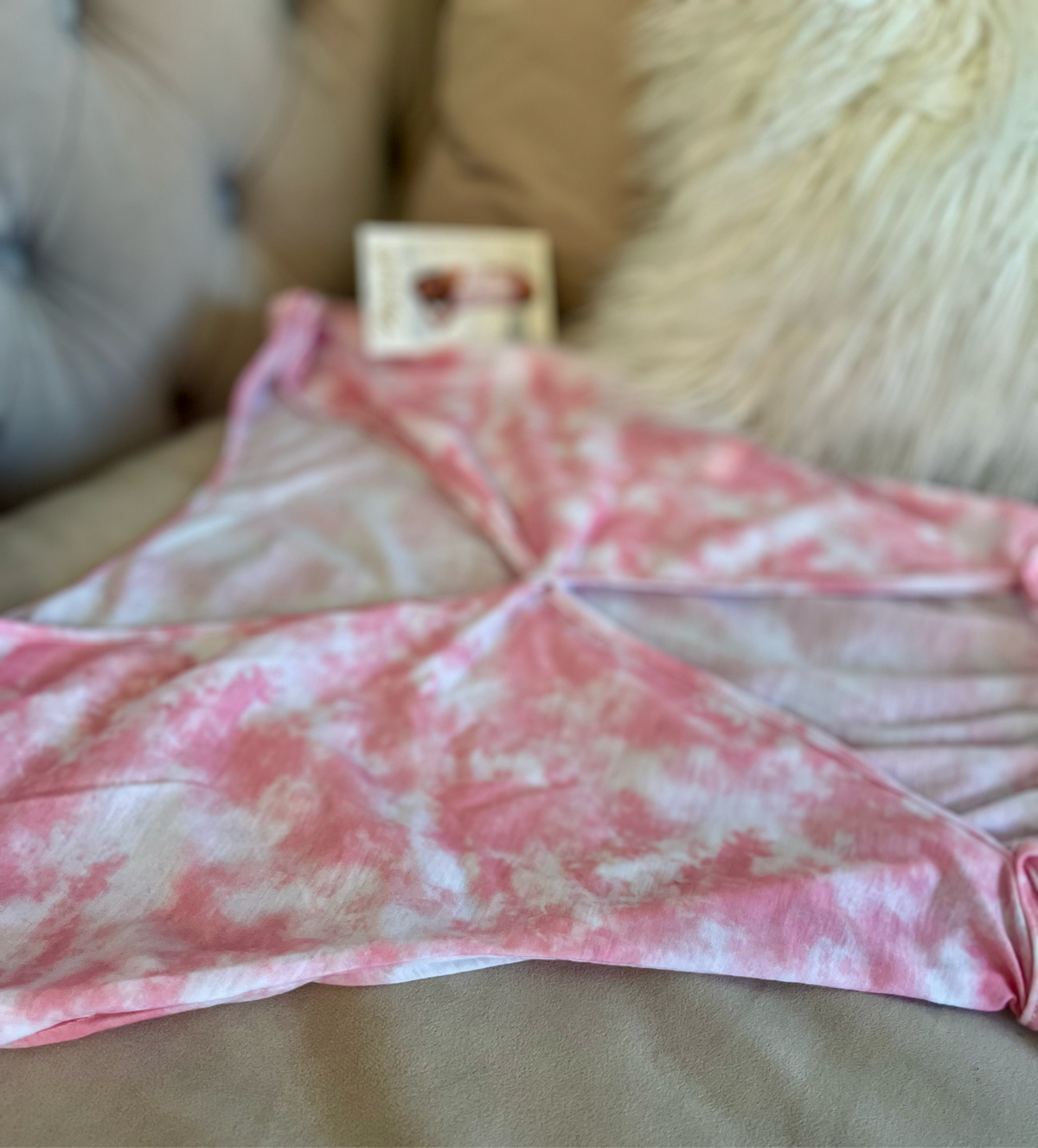 Model wearing pink tie dye off shoulder sleeper
