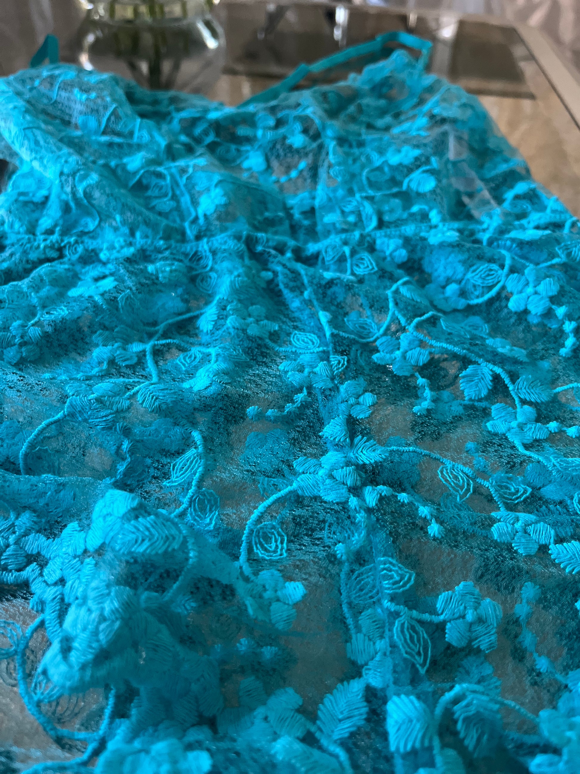 Turquoise lace romper styled look, side angle